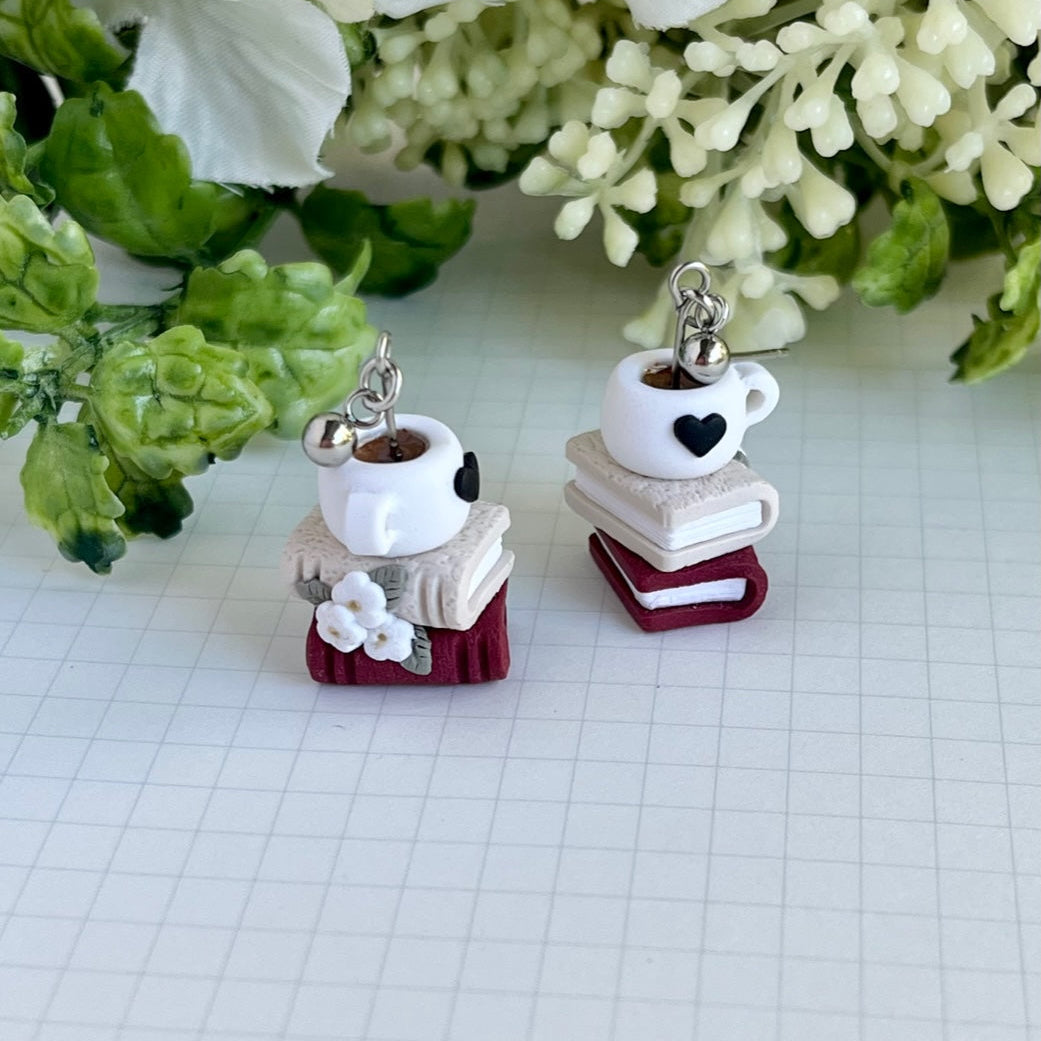 Whimsical coffee mug or tea cup sitting on books polymer clay earrings with stainless steel posts
